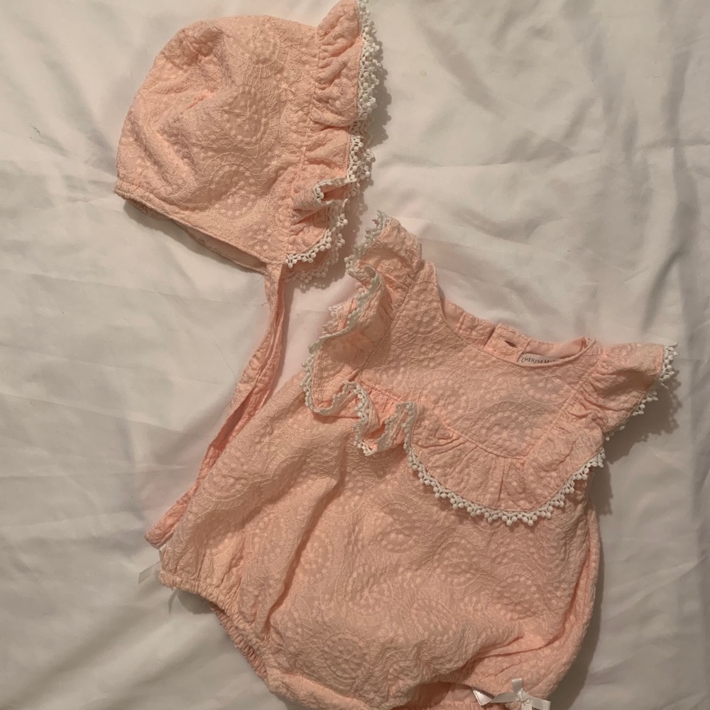 Beautiful pink lace onesie with matching bonnet